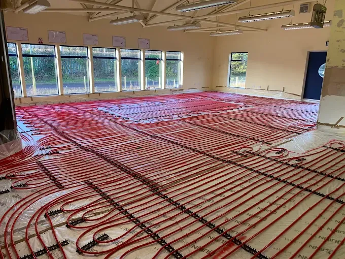 Underfloor heating pipework installed across a large room