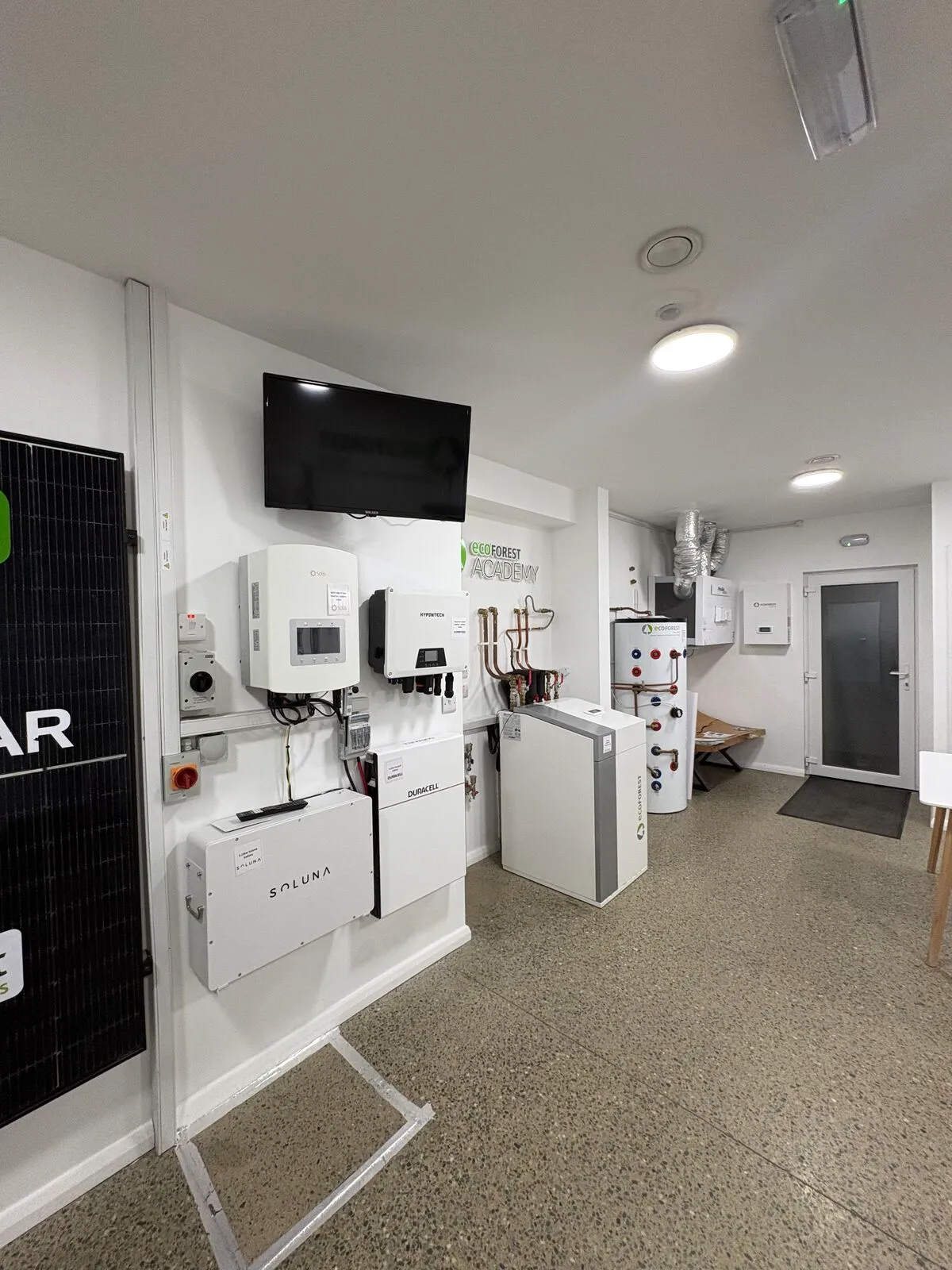 EHP showroom with solar inverters and heat pump units on display